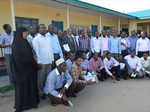 Garissa Governor Nathif Jama (centre, in coat and tie) poses for a group photo with county assembly members during the opening ceremony on April 22, 2013 /STEPHEN ASTARIKO
