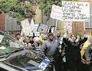 Protesters gather at Cape Town magistrate’s court in 2014, when alleged 28s  kingpin Ralph Stanfield made his first appearance on charges relating to a guns-to-gangs syndicate.