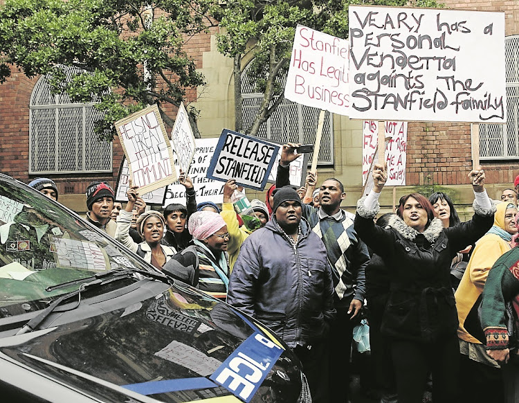Protesters gather at Cape Town magistrate’s court in 2014, when alleged 28s kingpin Ralph Stanfield made his first appearance on charges relating to a guns-to-gangs syndicate.