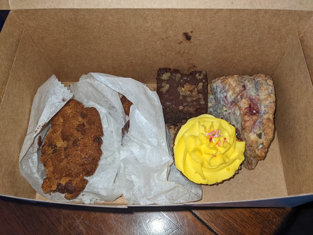 Half of my chocolate chip cookie, chocolate cupcake, brownie, and raspberry lemon scone