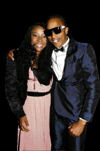 LIVING IT UP: Uyanda Mbuli with Tebogo Lerole at his birthday party in Sandton on Friday. Pic. Mohau Mofokeng. 19/06/2010. © Sowetan.