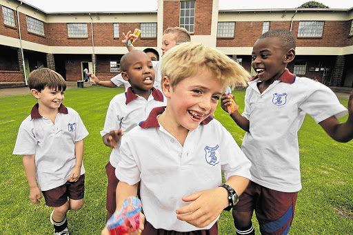 Pupils at Broadlands Private School in Meyerton, south of Johannesburg, fool around on the playground after school Picture: NINA BEKINK