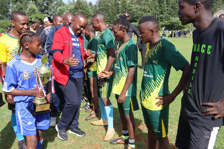 Mathioya MP Edwin Mugo with Nyangiti FC players at Rurii stadium on April 15, 2024.