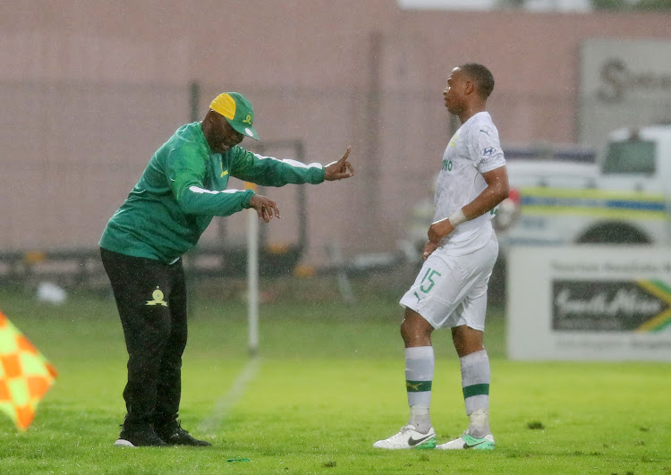 Mamelodi Sundowns coach Pitso Mosimane dishes out instructions to midfielder Andile Jali during a match.