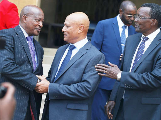 Attorney General Paul Kariuki (L) and Chief Justice David Maraga(R) congratulates Twalib Mbarak after his swearing in as the Secretary/Chief Executive officer of the Ethics and Anti Corruption Commission at the Supreme Court buildings yesterday. Photo/Jack Owuor