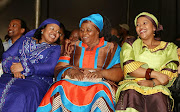 Jacob Zuma the South African President had a party at his hometown in Nkandla celebrating his victory as the South African President.  Jacob Zuma's wives sharing a light moment from left is Nompumelelo Ntuli, Sizake MaKhumalo  Zuma and Thobeka Madiba (formerly Mabhija). Picture Credit: Simphiwe Nkwali.  © Sunday Times