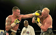 Kevin Lerena   connects with a straight left through the defence of  Dmytro Kucher. 
