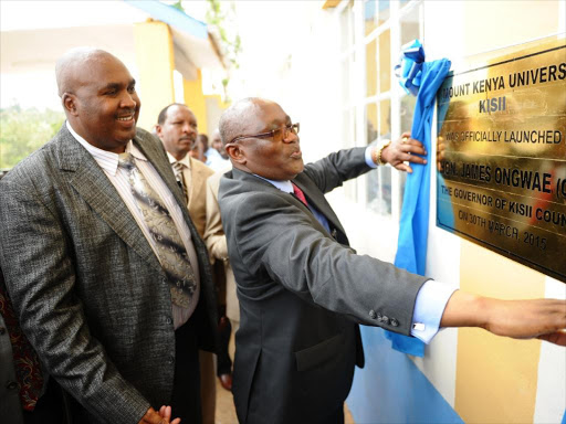 NEW BRANCH: MKU chairman Simon Gicharu and Governor James Ongwae commission the new MKU Campus in Gensonso, Kisii, on April 1, 2015