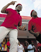 SUNDAY STUMP: EFF leaders Dali Mpofu, left, and Julius Malema egg on the crowd at Ratanda township, near Heidelberg, yesterday. Mpofu is the EFF's candidate for the premiership of Gauteng