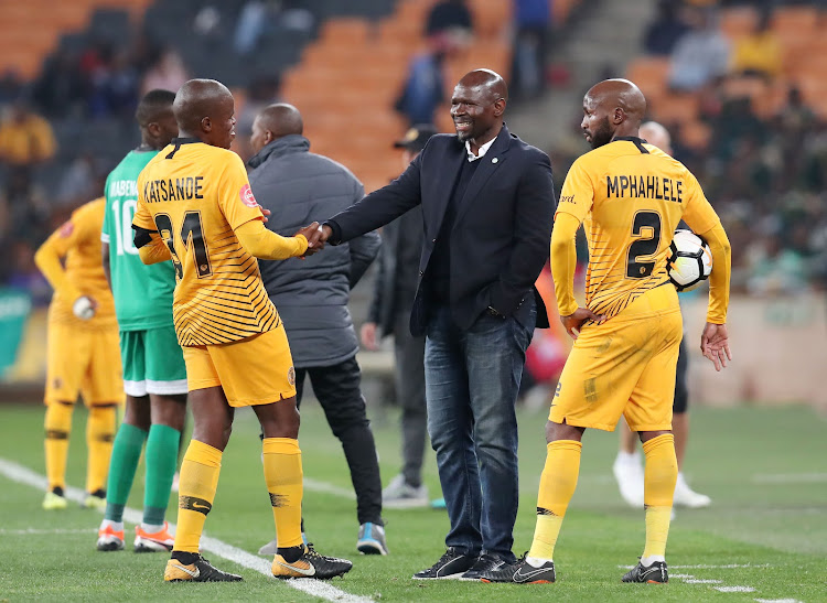 Bloemfontein Celtic coach Steve Komphela shakes hands with his former players Williard Katsande and Ramahlwe Mphahlele during the Absa Premiership match against Kaizer Chiefs at FNB Stadium on August 29 2018.