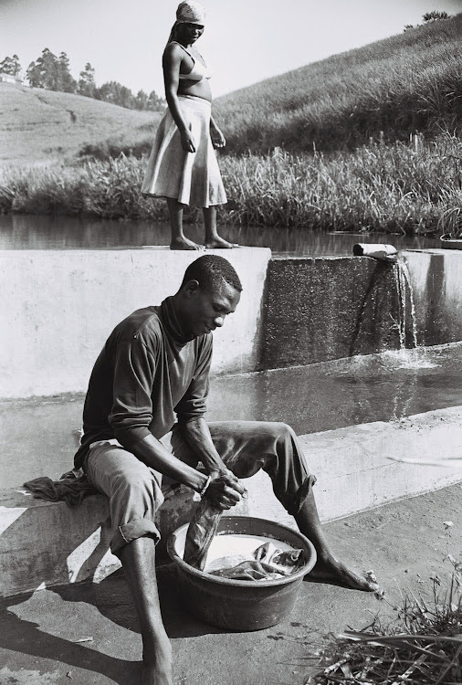 Man Washing Clothes, 2003, Emakhaya Series, by Andrew Tshabangu.