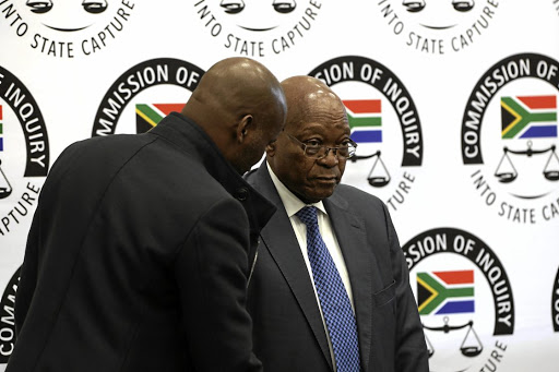 Former president Jacob Zuma prepares to testify on his second day at the Zondo commission of inquiry into state capture in Parktown, Johannesburg, yesterday.