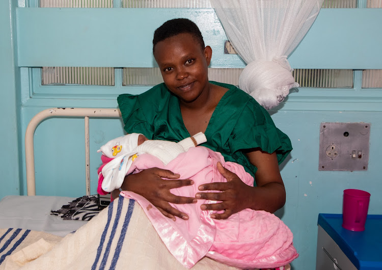 Mary Wanjiru holds her newborn baby, Havan Kanyari, at Pumwani Maternity and Referral Hospital.