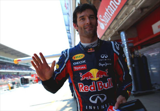 Mark Webber of Australia and Red Bull Racing celebrates after finishing first during qualifying for the Spanish Formula One Grand Prix at the Circuit de Catalunya on May 21, 2011 in Barcelona, Spain