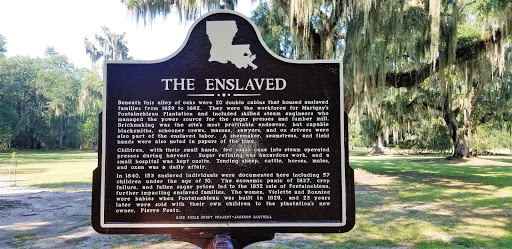 Beneath this alley of oaks were 20 double cabins that housed enslaved families from 1829 to 1862. They were the workforce for Marigny's Fontainebleau Plantation and included skilled steam...