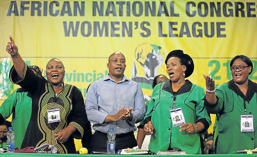 DECISIVE ACTION: The ANC Women’s League Eastern Cape Provincial Conference was held at Wilsonia Methodist Church over the weekend. From left, Gloria Fanta, Eastern Cape premier Phumulo Masualle, Xoliswa Makasi and Agnes Qikani in the forefront singing with the delegates. Fanta was elected new chairperson yesterday PICTURE ALAN EASON