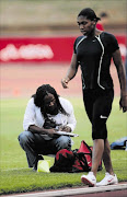 POTENTIAL DANGER: South Africa's 800m star Caster Semenya seen here with  her trainer Maria Mutola, squatting 
       Photo: JAMES OATWAY