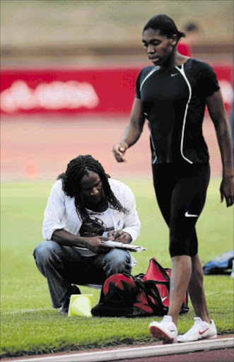 POTENTIAL DANGER: South Africa's 800m star Caster Semenya seen here with her trainer Maria Mutola, squatting Photo: JAMES OATWAY