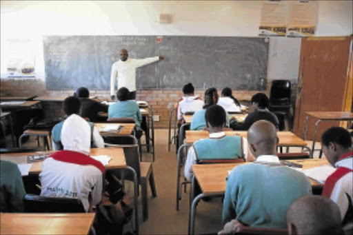 Scores of enthusiastic pupils at Tetelo Secondary School in Soweto gave up their winter school holidays to attend winter school lessons conducted by teachers such as Maurice Chauke, above Picture: DANIEL BORN
