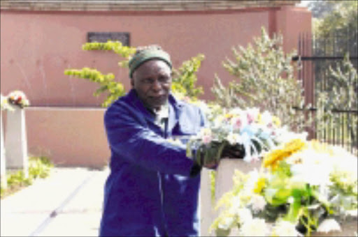 REMEMBRANCE: Azanian People's Liberation Army veteran Buti Mofokeng lays fresh flowers during the commemoration of the Sharpeville massacre at the Sharpeville Human Rights Precinct on Saturday. 21/03/2009. Pic. Bafana Mahlangu. © Sowetan.