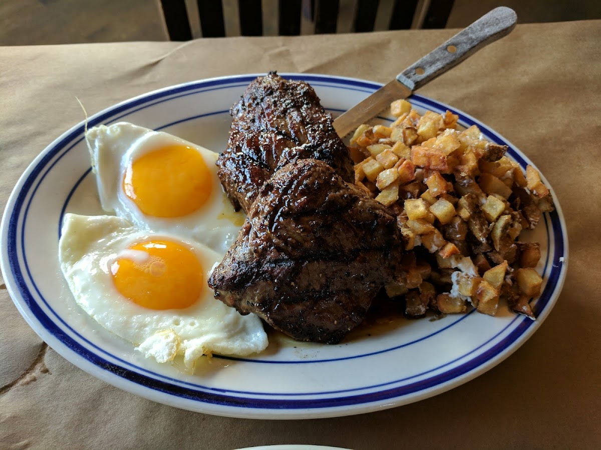 Steak, eggs, and Ash browns with goat cheese