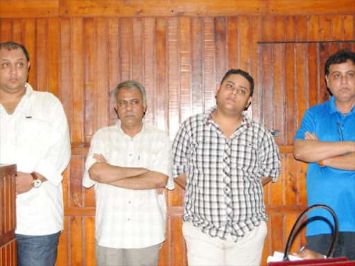 A file photo of Baktash Akasha, Gulam Hussein, Ibrahim Akasha and Vijaygiri Goswami at the chief magistrate's court in Mombasa. /MKAMBURI MWAWASI