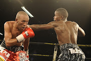 Simphiwe Vetyeka and Lerato Dlamini during the Four go to War boxing bout at Emperors Palace on October 21, 2017 in Johannesburg, South Africa.