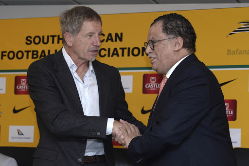 Newly appointed Bafana Bafana head coach Stuart Baxter (L) shakes hands with SA Football Association (SAFA) Danny Jordaan a press conference at SAFA House on May 15, 2017 in Johannesburg, South Africa.
