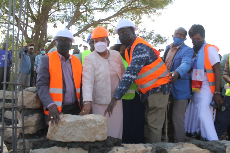 Matungulu MP Stephene Mule, Machakos Senator Agnes Kavindu and Mavoko MP Patrick Makau laying a stone in the ongoing construction of Matungulu KMTC in Machakos on Sunday.