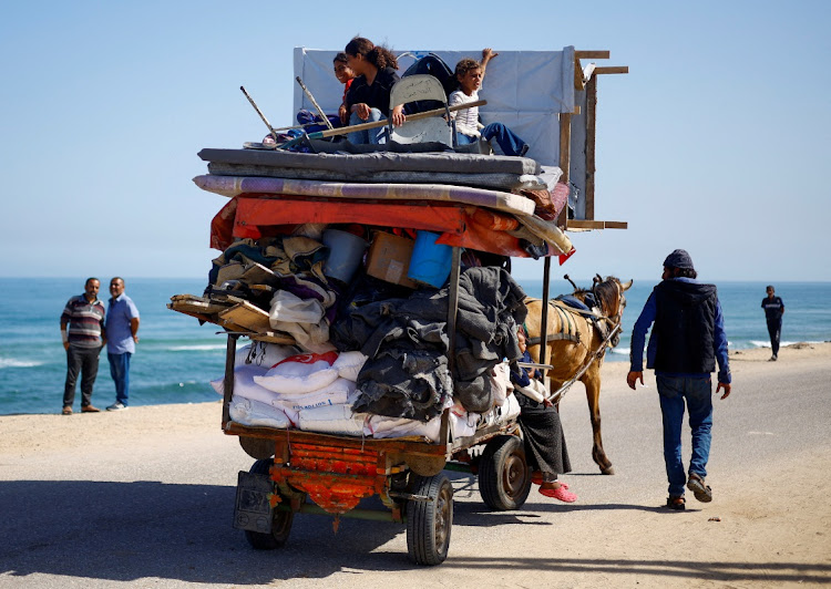 Palestinians travel in an animal-drawn cart as they flee Rafah after Israeli forces launched a ground and air operation in the eastern part of the southern Gaza city on May 9 2024. Picture: MOHAMMED SALEM/REUTERS