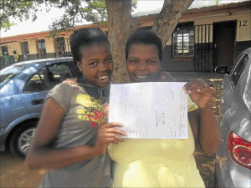 LUCKY ONE: Regolotswe High School Grade 10 pupil Ntswaki Mooki and her mother Ntheboleng celebrate after finding out that she had actually passed. Photo: Boitumelo Tshehle