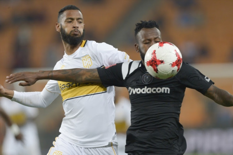 Taariq Fielies of Cape Town City and Mpho Makola of Orlando Pirates during the Absa Premiership match between Orlando Pirates and Cape Town City FC at FNB Stadium on September 19, 2017 in Johannesburg.