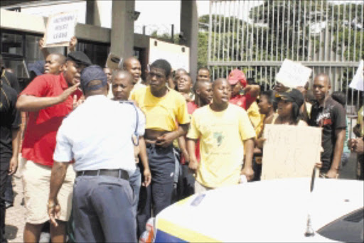 IN ACTION: Students protest over proposed fee increase at the Mangosuthu University of Technology in Mlazi, KwaZulu Natal, yesterday. Pic: THULI DLAMINI. 12.01/2010. © Sowetan.