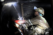 A drill operator working underground at Lonmin’s western platinum mine at Marikana