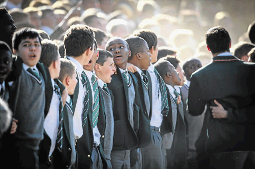 Pupils at King Edward VII chant their war cry. File photo