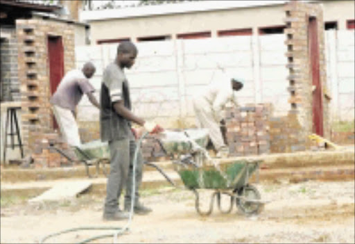 BUILDING BLOCKS: Construction trainees do practical work as part of their learnership programme in Thembisa. Pic: Veli Nhlapo. 05/10/2009. © Sowetan.