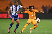 Kaizer Chiefs midfielder Nkosingiphile Ngcobo (R) shields the ball away from with Deolin Mekoa of Maritzburg United (L) during the Absa Premiership match at FNB Stadium in Johannesburg on March 09, 2019.