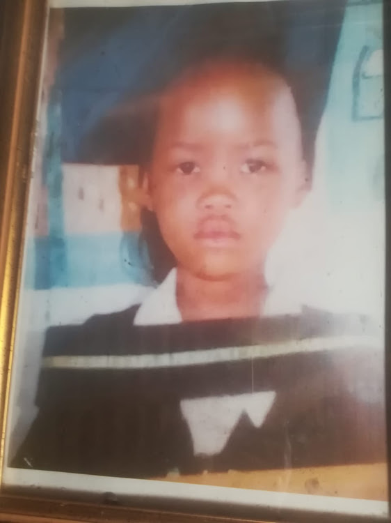 A photograph of Kopano Molelekedi taken when she graduated to grade 5 at Durban Deep Primary School in 2017. Her family couldn't afford to print many images of her and didn't expect photos would be the only thing left of her.