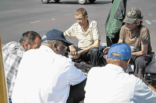 Jansen speaks to white hobos about why they became beggars