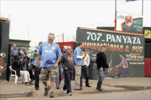 A file photo of rugby fans having a jol at Panyaza, a braai and pub at nearby White City section across from Soweto's Orlando Stadium. Pic: Bongani Mnguni.