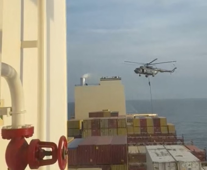 An official slides down a rope during a helicopter raid on MSC Aries ship at sea in this screen grab obtained from a social media video released on April 13 2024. Picture: REUTERS