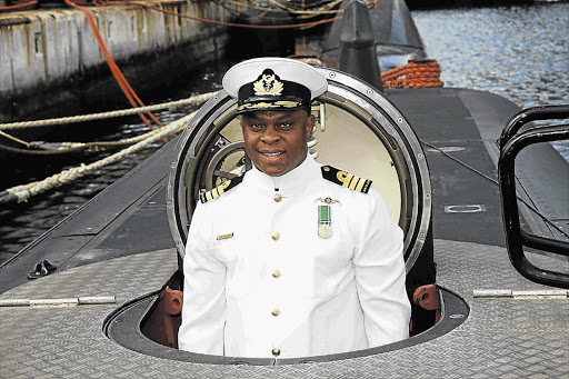 Commander Handsome Thamsanqa Matsane stands in the conning tower of the SAS Queen Modjadji as he becomes the first black naval commander of a South African submarine. File photo.