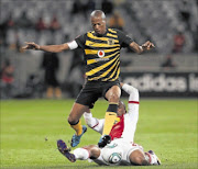 RECOVERING: Jimmy Tau from Kaizer Chiefs evades a tackle from Thembinkosi Fanteni of  Ajax Cape Town. Photo: Gallo Images