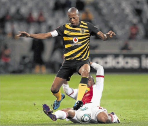 RECOVERING: Jimmy Tau from Kaizer Chiefs evades a tackle from Thembinkosi Fanteni of Ajax Cape Town. Photo: Gallo Images
