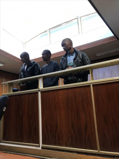 WELL GUARDED: Lwandile Lolwana, Nkosana Mpe and Thandanani Mpongolo appeared in the East London Magistrate's court yesterday. Picture: ZWANGA MUHUTHU
