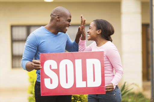 Young couple buying a house.