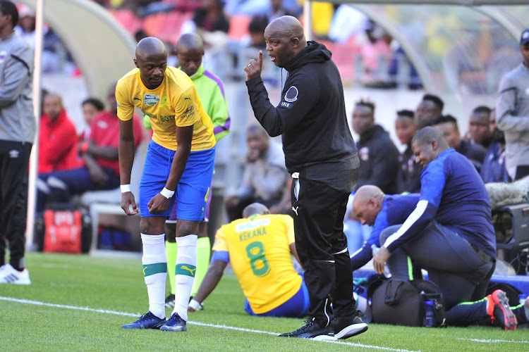Tebogo Langerman listens to coach Pitso Mosimane during the match.