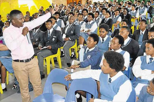 INSPIRED: Mthatha-born mining engineer cum motivational speaker Tandile Sicetsha had pupils eating out of his hand when he delivered a motivational talk at his alma mater, Zingisa Comprehensive High School in Mthatha Picture: LOYISO MPALANTSHANE