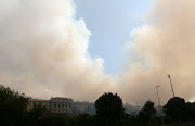 University of Cape Town students have been evacuated as a runaway fire that started at the Rhodes Memorial on Sunday morning spread onto the campus.