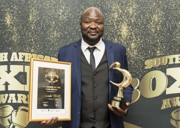 Promoter Ayanda Matiti with the trophy and certificate he received for winning Promoter of the Year in 2023. Picture: MICHAEL SHEEHAN